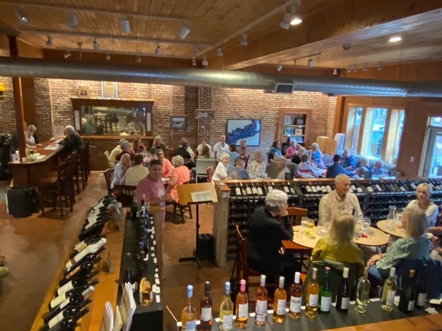 Guests enjoying a game night in a warm, wood-beamed venue