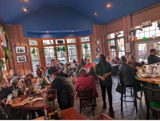 Guests playing together in a bright local venue